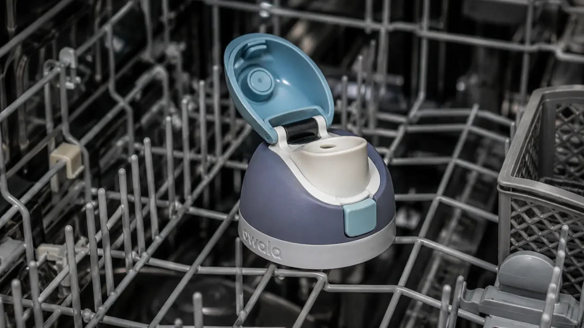 Owala FreeSip lid sitting upright on a dishwasher’s top rack
